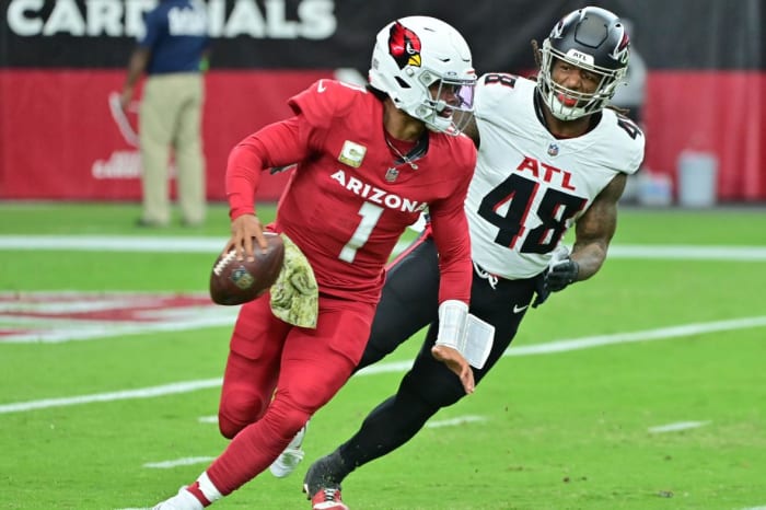 Arizona Cardinals quarterback Kyler Murray (1) is chased by Atlanta Falcons linebacker Bud Dupree (48) in the first half at State Farm Stadium.